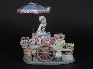A Lladro figure group - The Flower Seller, base marked 1454  12"  ILLUSTRATED
