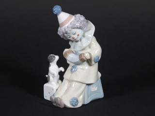 A Lladro figure of a clown accordionist with dog 7"