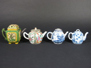 An Oriental square green and yellow glazed teapot 4", a Canton  famille rose teapot 3" and 2 other Oriental teapots