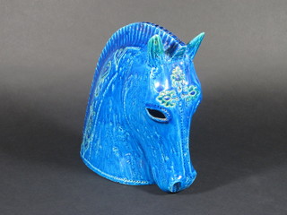 A blue glazed Oriental style pottery figure in the form of a horses head 9"