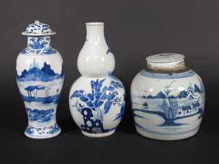 An Oriental blue and white shaped double gourd shaped vase decorated figures 10", a blue and white ginger jar and cover 8",  1 other urn and cover 11"