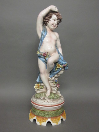 An Italian pottery figure of a standing cherub 33"