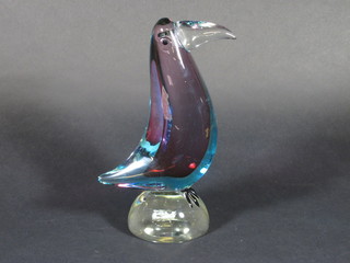 A glass figure of a seated bird 10"