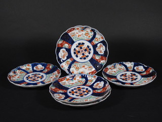 5 19th Century circular Japanese Imari porcelain plates with  lobed borders 9", all chipped,