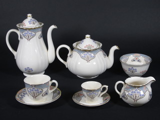 A 30 piece Masons Ironstone tea/coffee set for Libertys in the  The Ianthe pattern, comprising teapot - slight chip to lid, sugar  bowl, cream jug, 6 cups and 8 saucers, coffee pot, 6 coffee cans  and 6 saucers - 1 cracked,