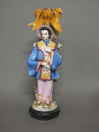 An Italian pottery figure of a standing Mandarin 29", f and r,