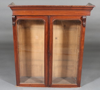 A Victorian mahogany cabinet with moulded cornice enclosed by glazed panelled doors 36"