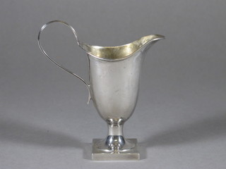 An Edwardian Georgian style cream jug raised on a square base, London 1900, 2 ozs