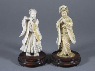 A pair of 19th Century Oriental carved ivory figures of lady musicians 4 1/2", some damage