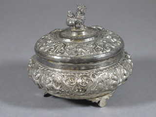 An Eastern circular embossed white metal jar and cover 3 1/2"