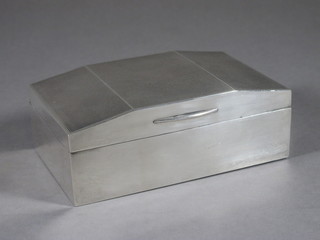An Art Deco silver cigarette box with engined turned decoration  and hinged lid, Chester marks rubbed, 5 1/2"