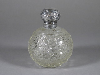 A Victorian globular cut glass scent bottle with silver collar Birmingham 1899, tear to lid, 4"  ILLUSTRATED