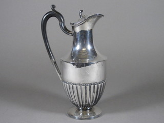 A Britannia metal hotwater jug with demi-reeded decoration