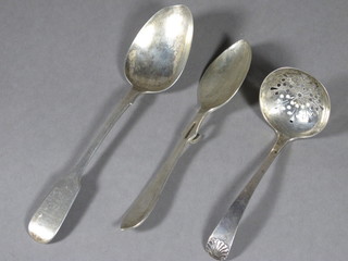 A Victorian silver fiddle pattern spoon Newcastle, a preserve spoon and a silver sifter spoon 2 ozs