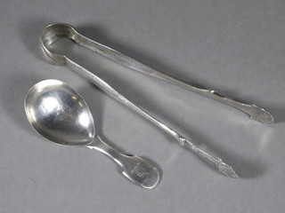 A George III silver fiddle pattern caddy spoon, London 1798 together with a pair of white metal tongs