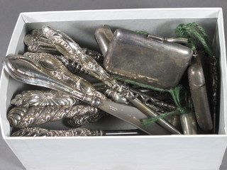 A collection of 10 silver handled button hooks, a silver handled shoe horn, 4 silver handled tweezers, nail buff, 2 vesta cases, a  folding corkscrew and a metal vesta case