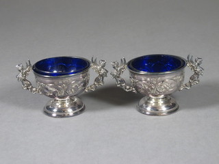 A pair of Edwardian embossed silver twin handled salts, Birmingham 1900, 2 ozs