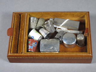 A rectangular silver box with hinged lid 1", a circular silver box  1", a silver cased tooth pick, a scent bottle and 8 various thimbles