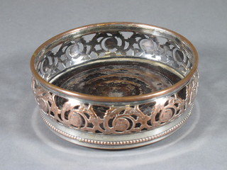A 19th Century pierced silver plated wine bottle coaster 5"