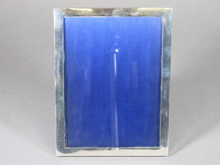 A silver easel photograph frame 8" x 6 1/2"