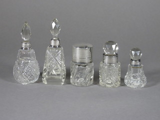 A cylindrical cut glass salt bottle with silver lid, London 1934  and 4 small cut glass dressing table jars with silver collars