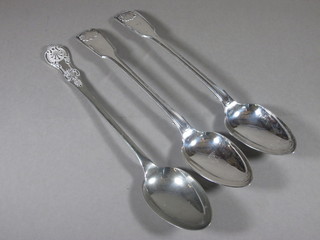 A pair of silver plated fiddle thread and shell pattern serving  spoons and 1 other serving spoon