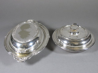 An oval silver plated twin handled entree dish and a muffin dish