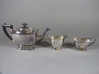 A silver plated 3 piece tea service with teapot, twin handled sugar  bowl and milk jug