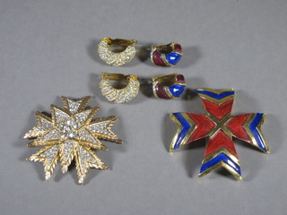 2 suites of Kenneth Lane jewellery comprising a gilt  multi-pointed star set brilliants and a pair of earclips, an enamelled cross and pair of ear clips, in original case