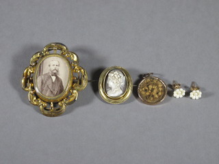 A pinchbeck mourning brooch with woven hair panel to the back,  a cameo brooch and a straw work pendant