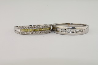 A 9ct white gold half hoop dress ring set diamonds together with a 9ct gold half hoop dress ring set yellow diamonds