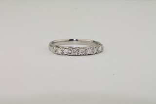 A platinum half eternity ring set diamonds
