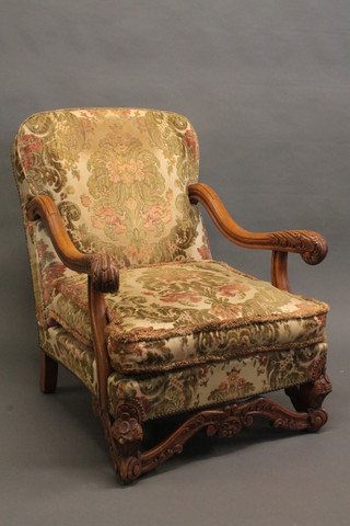 A pair of Italian style carved walnut open arm chairs with  upholstered seats and backs