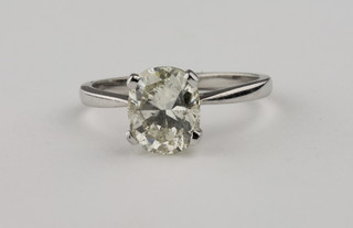A lady's 18ct white gold dress ring set an oval cut diamond,  approx 2.47ct, with certificate,