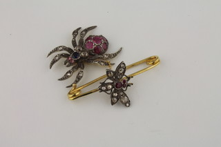 An attractive gold brooch in the form of a spider and a fly set rubies, diamonds and pearls