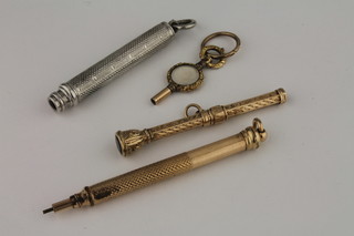 2 gilt metal propelling pencils, a gilt metal watch key and a silver propelling pencil