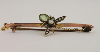 A 9ct gold bar brooch in the form of an insect the body set a  peridot, the wings set pearls