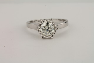 A lady's 18ct white gold solitaire dress/engagement ring set a  circular cut diamond, approx 0.90ct