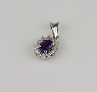 A lady's 18ct white gold amethyst and diamond pendant