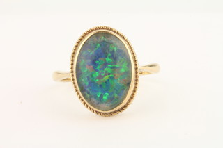 A lady's 18ct gold dress ring set an opal