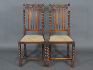 A set of 6 carved oak stick and bar back dining chairs raised on turned supports