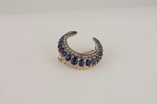 A Victorian crescent shaped brooch set sapphires and diamonds