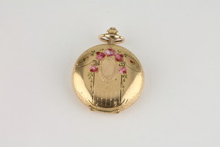 A lady's 14ct gold fob watch contained in an enamelled and  engraved case