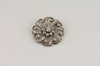 A Victorian diamond set cluster brooch  ILLUSTRATED
