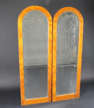 A pair of 19th Century arch shaped bevelled plate mirrors  contained in satinwood frames 38"