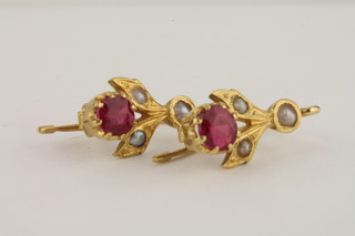 A pair of 18ct gold earrings set red stones and pearls