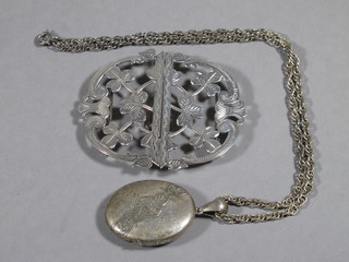 An Edwardian silver buckle Birmingham 1901 and a Victorian  silver locket 1880 hung on a silver chain