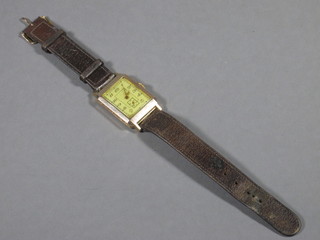 A gentleman's rectangular wristwatch contained in a 9ct gold case