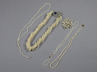 A pearl multi link necklace with gilt metal clasp, 3 pearl necklaces and a pearl pendant in the form of a cross