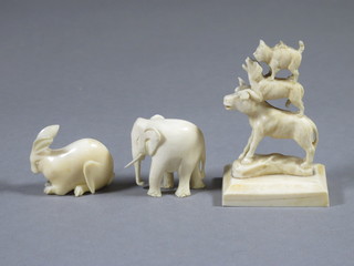 A carved ivory figure of 3 balancing animals 2", a carved figure  of a hare 1", do. elephant 1"